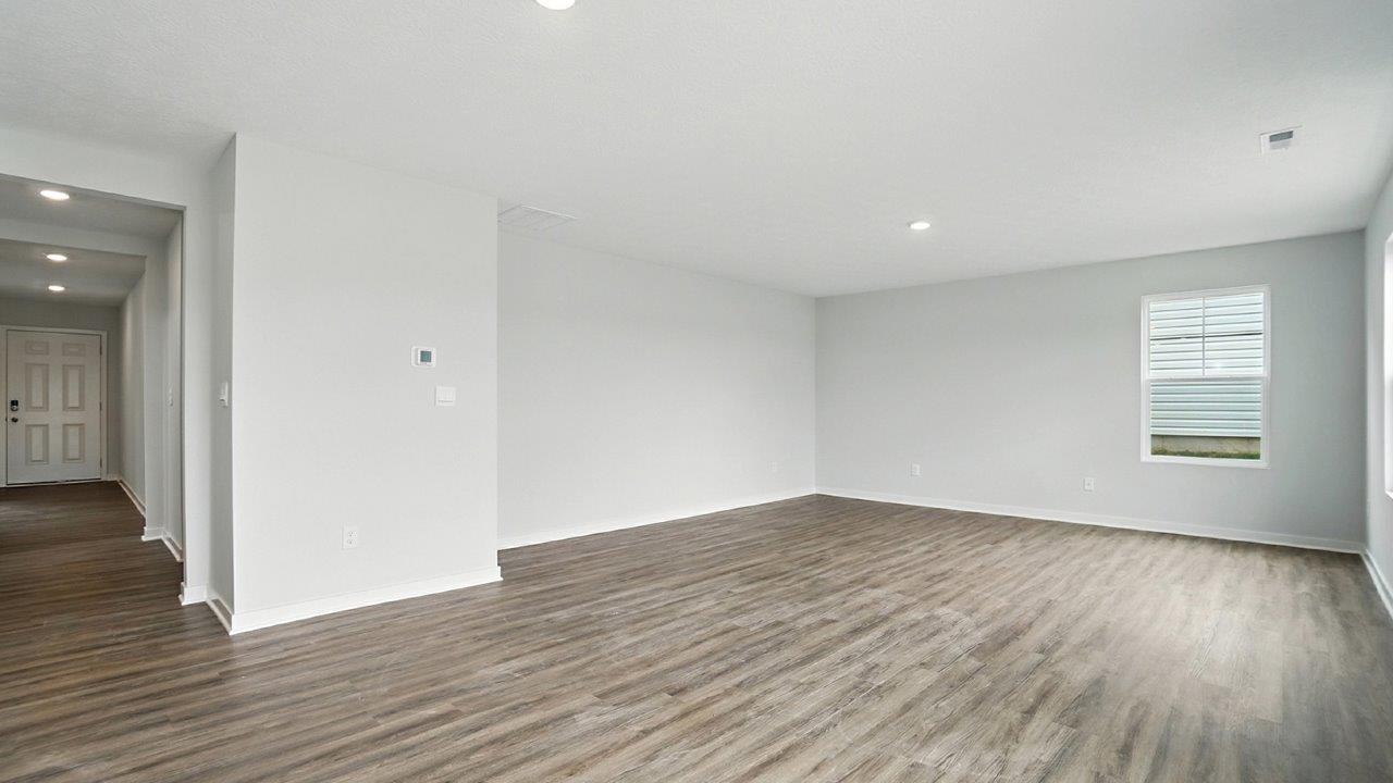 great room with single window and foyer