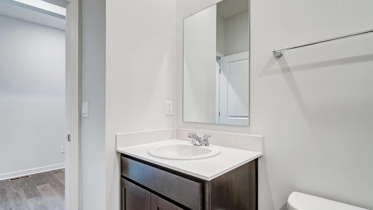 Newcastle bathroom 2 with dark stain cabinets