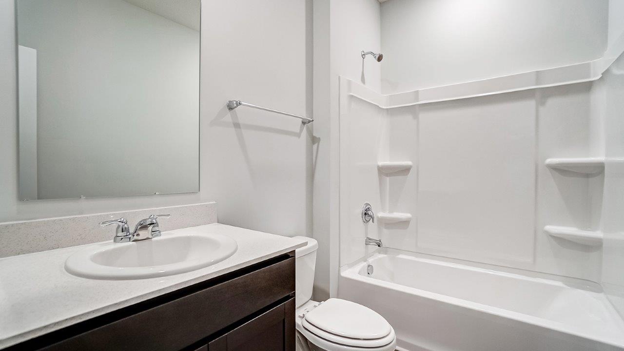 Newcastle Bathroom 2 with dark stain cabinets