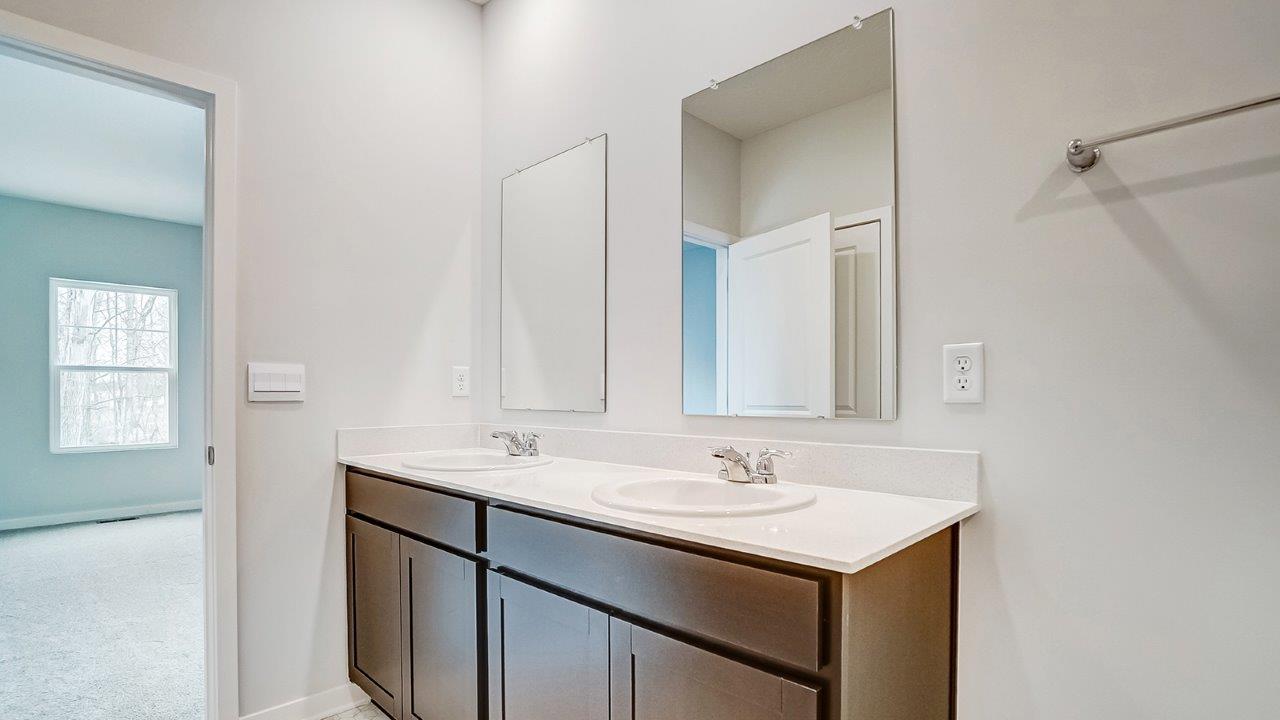 Newcastle Bathroom 1 with dark stain cabinets