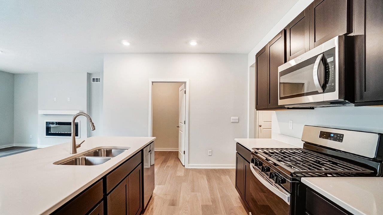 Newcastle kitchen with dark stain cabinets