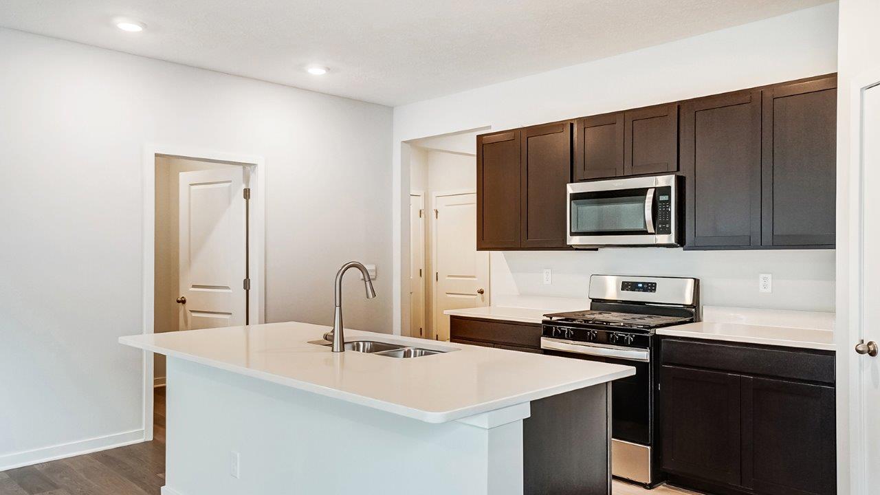 Newcastle kitchen with dark stain cabinets