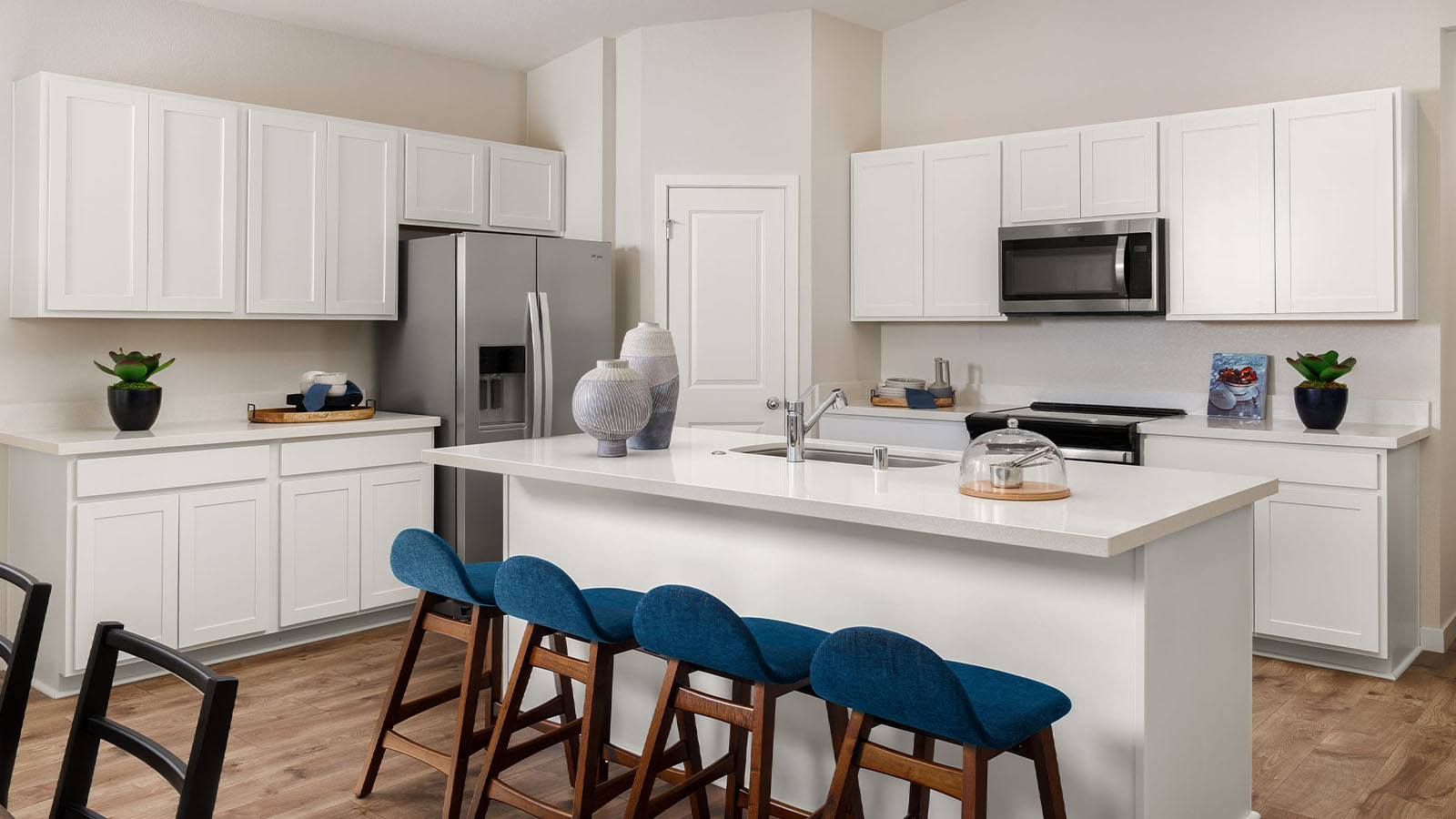 Montego Cali Plan 1924  bright modern kitchen with island and seating