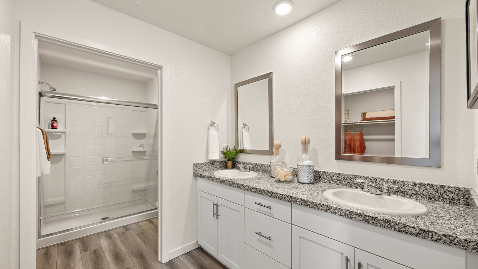 Harter Estates Meadow Plan1501  primary bathroom with dual sinks and walk in oversized shower