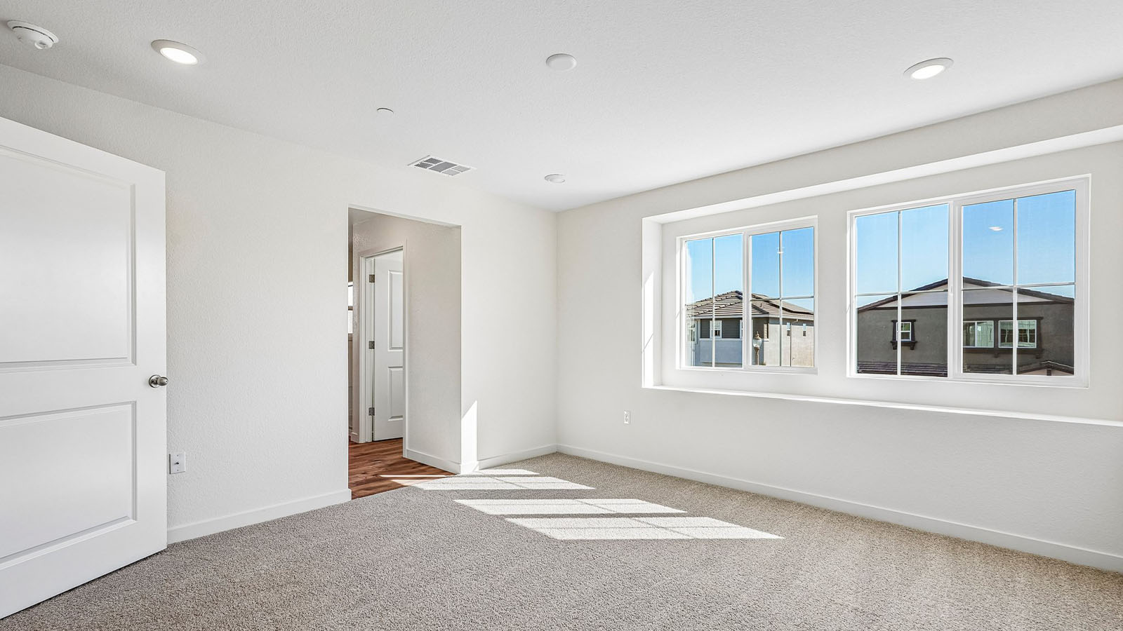 Jasper Clementine Plan 1811 spacious primary bedroom with natural light