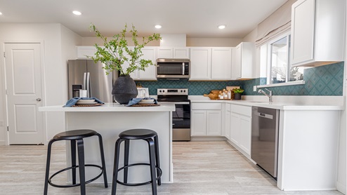 Modern kitchen with quartz countertops and stainless steel appliances