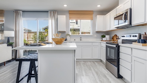 Modern kitchen with quartz countertops and stainless steel appliances