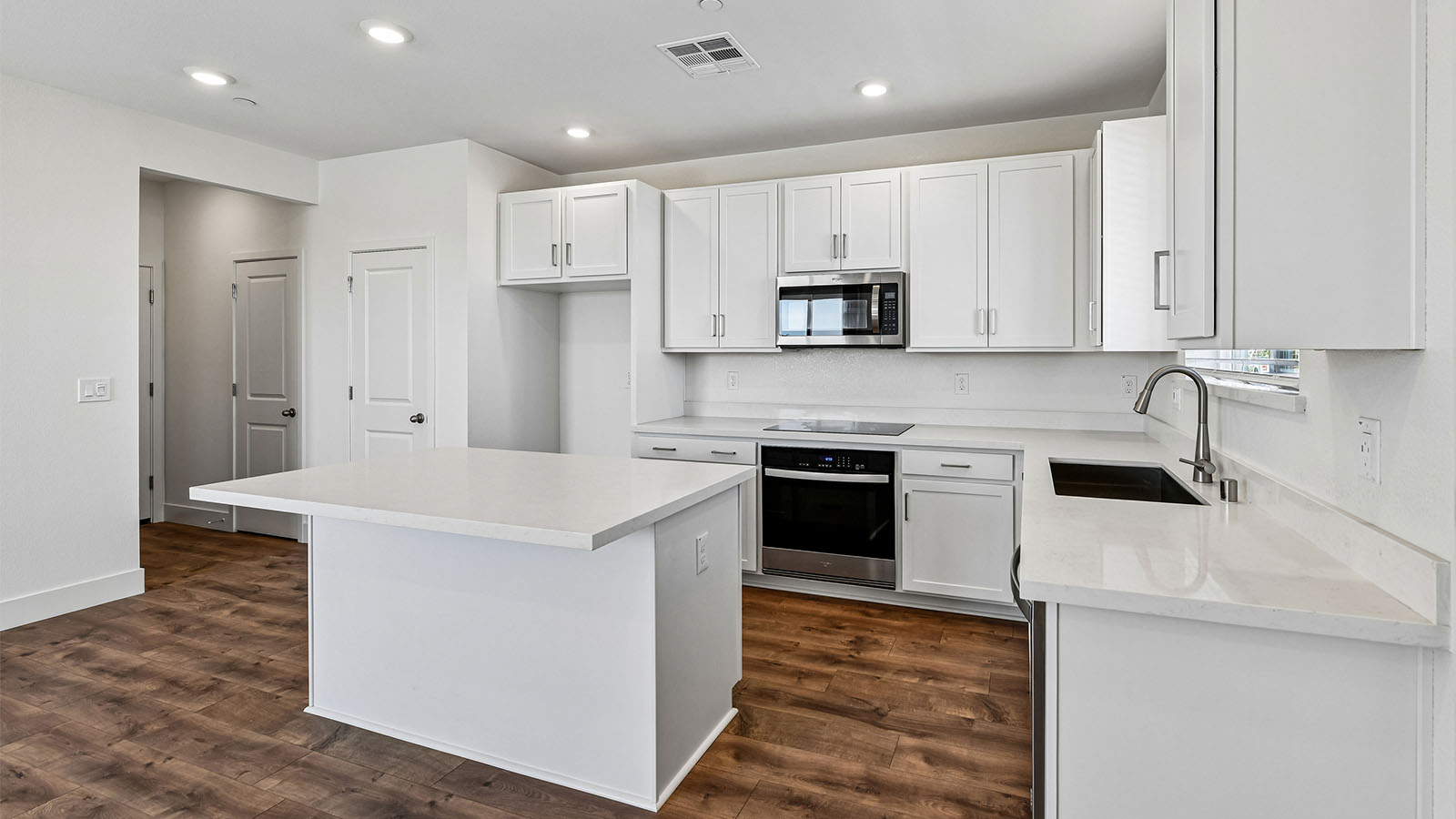 Lucia at Delta Shores Alta Plan 1578 open bright modern kitchen with island and room for seating