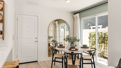 Open dining area near attached garage entrance