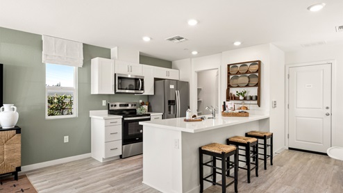 Peninsula shaped countertop easily fits 3 seats