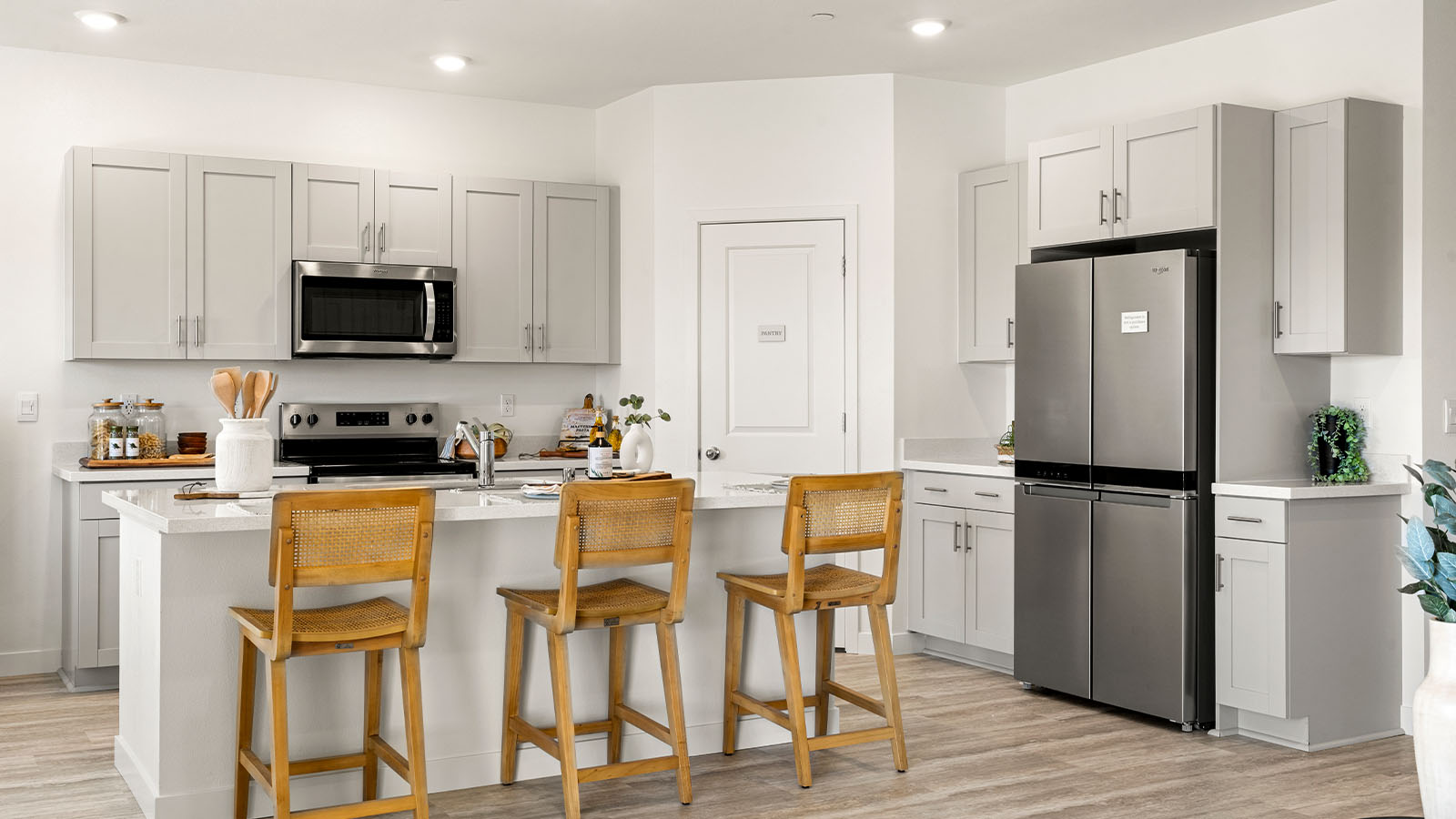 Magnolia at Shastina Ranch Plan 2035  bright modern kitchen with island and seating