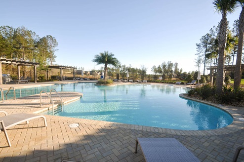 Zero-entry, resort-style pool with water fountains.