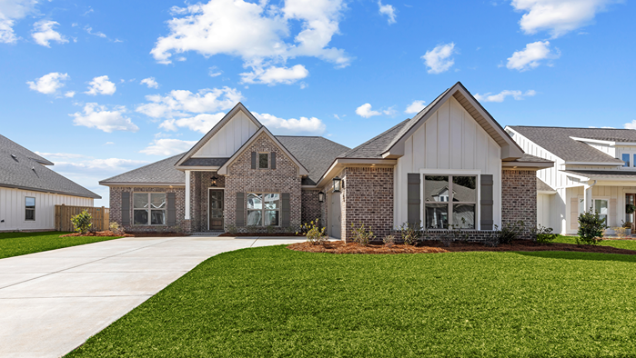 New home exterior of white brick Birch floorplan.