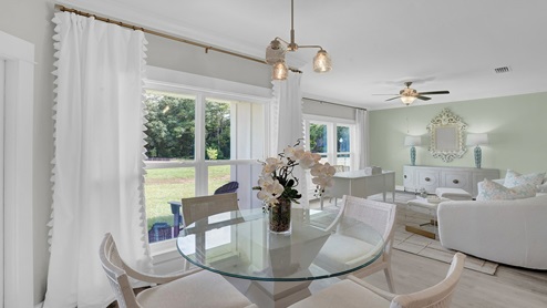 Breakfast nook with large window in modern home.