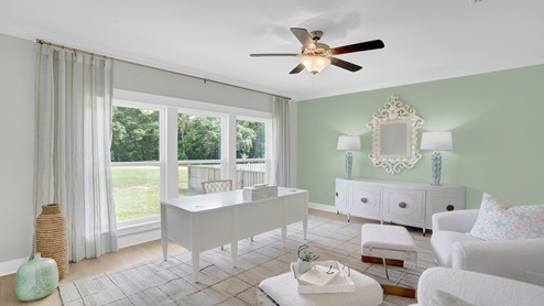 Gorgeous keeping room set up as office with large window.