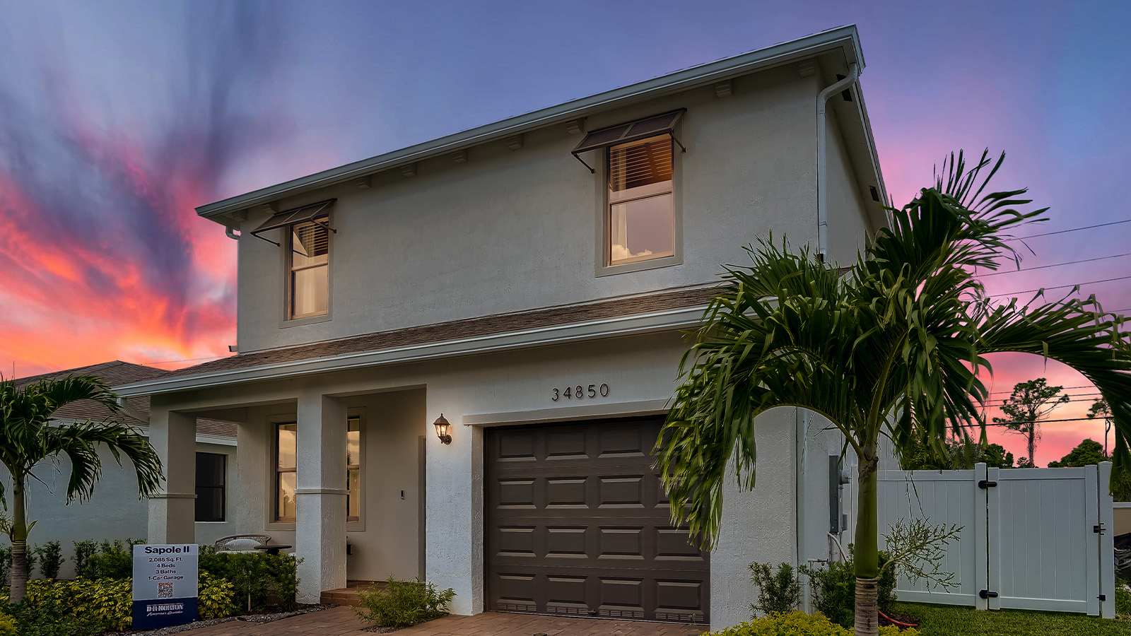 front exterior of two story home at sunset