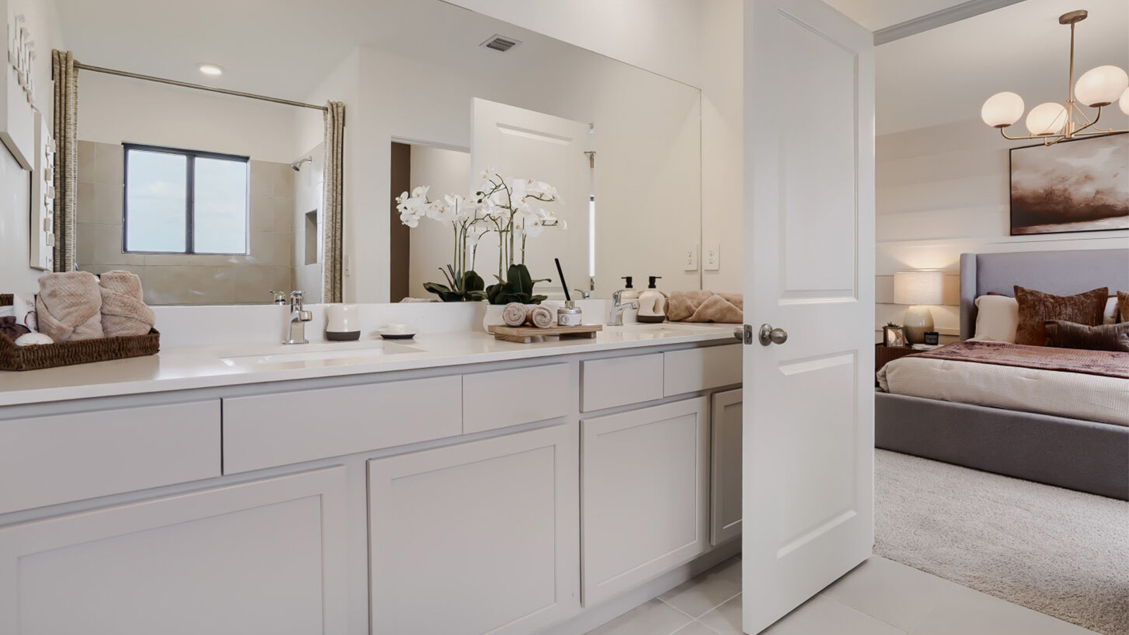 primary bathroom with dual vanaities
