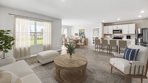 Inside of the Aria living room. This photo demonstrates that the living room connects to the kitchen, dining area, as well as bedroom three.