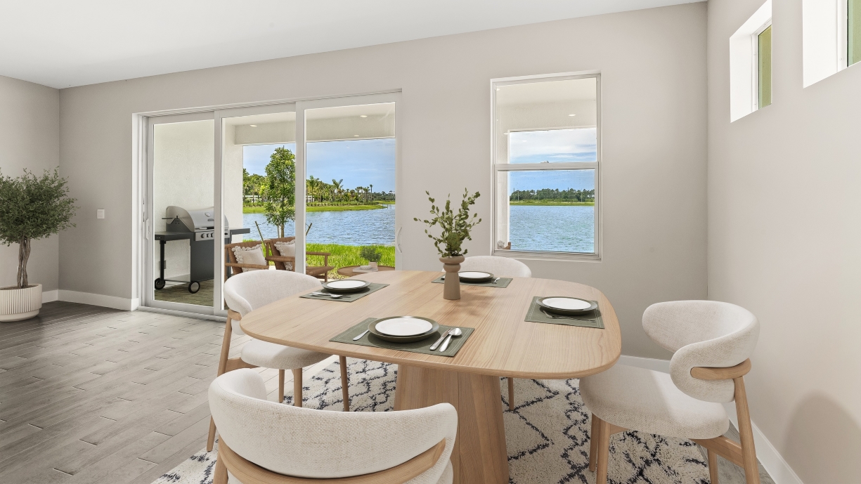 Inside of the Shelby dining room area. Three small windows above a wall and view of the patio.