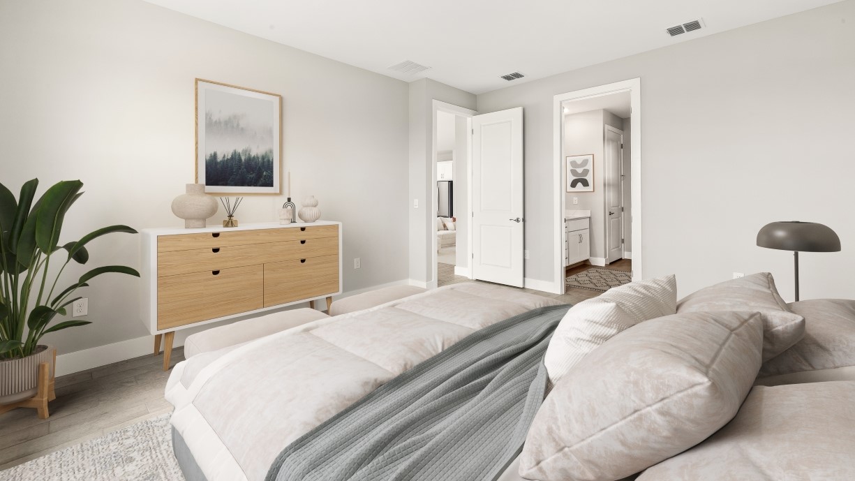 Inside of the Shelby primary bedroom. Window that looks to the outside and brings in natural lighting. Walk in closet that opens to the laundry room.