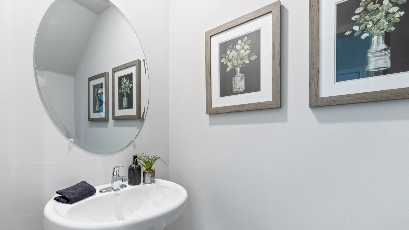 Inside bathroom one of the pierson. Shows a sink with a mirror.