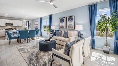 Inside of the Jemison model living room. This photo demonstrates the open concept of the dining area and kitchen.