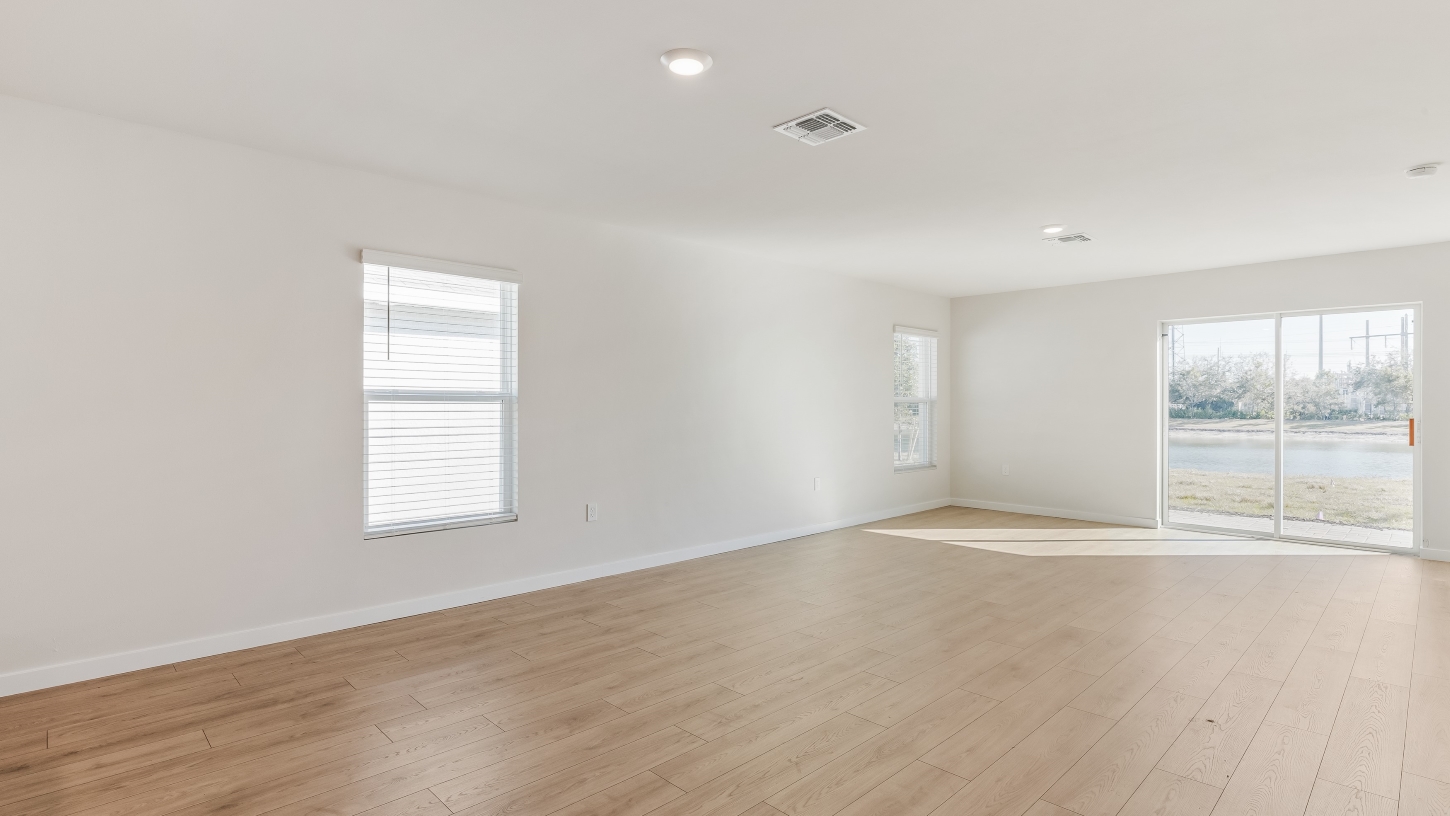 Inside of the Cameron B model living area. Revwood floors and white walls.