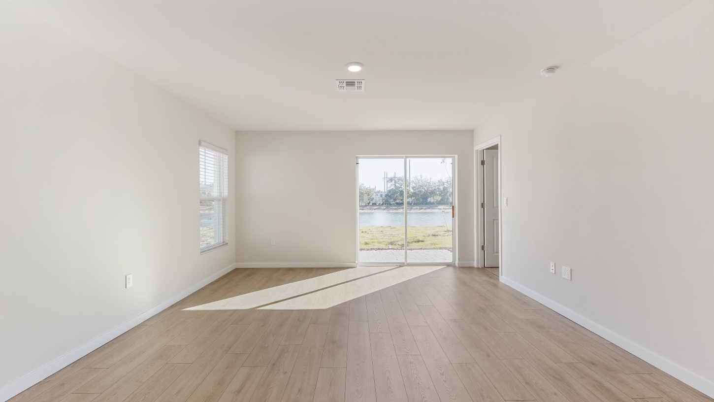 Inside of the Cameron B model living area. Revwood floors and white walls.