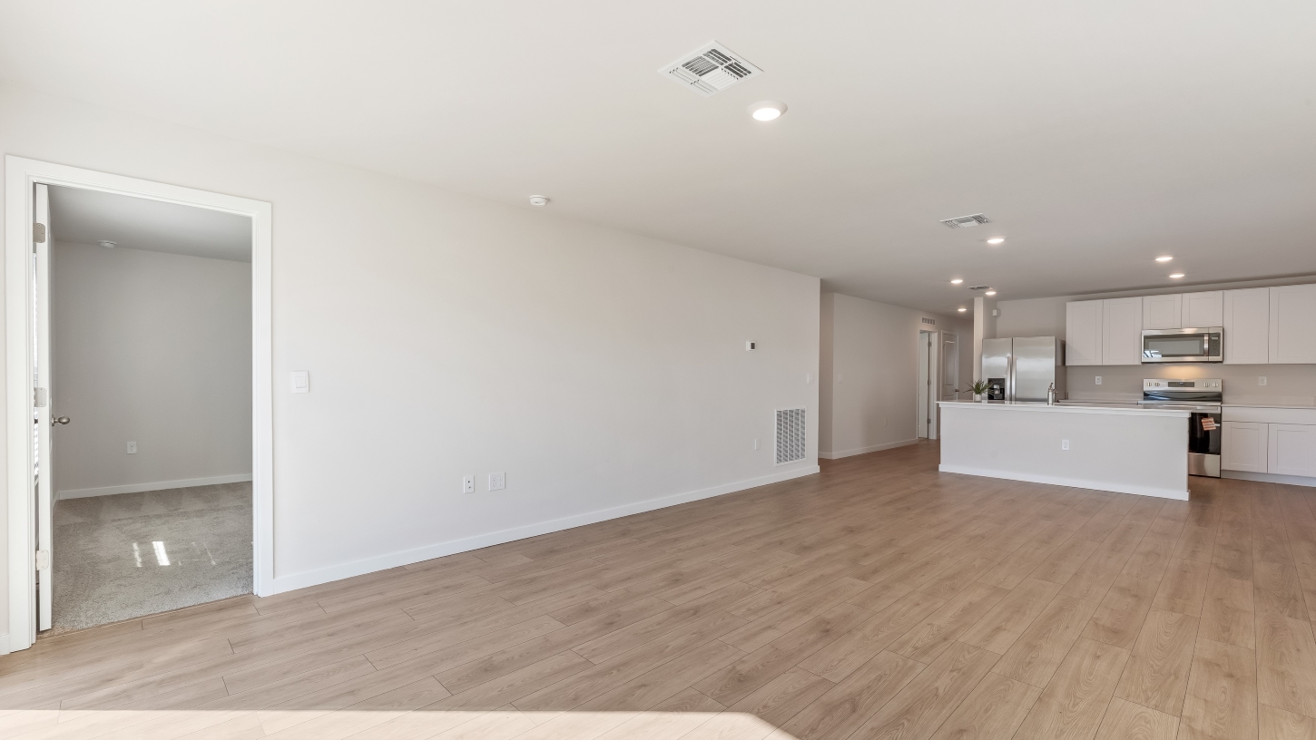 Inside of the Cameron B model living area. Revwood floors and white walls.