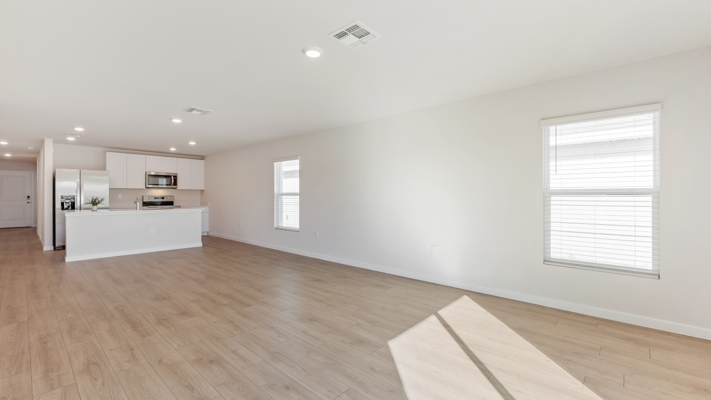 Inside of the Cameron B model living area. Revwood floors and white walls.