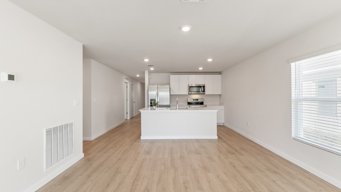 Inside of the Cameron B model living area. Revwood floors and white walls.