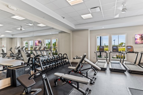 Amenity center fitness center with weight lifting machines and cardio machines