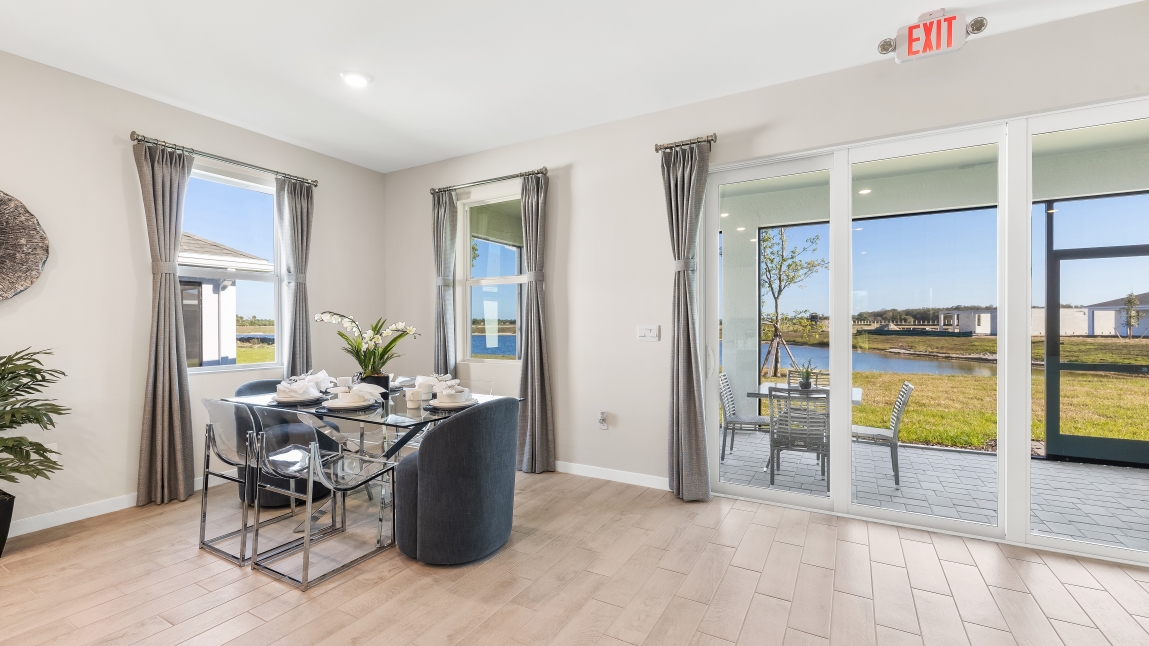 Inside the Lantana model dining space. Table with seating for four. Connects to the outdoor patio space.