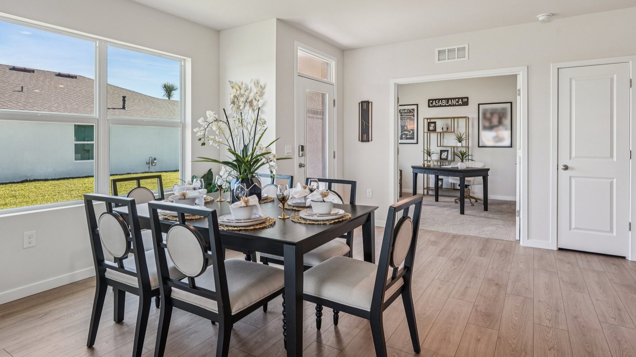 Inside the Carrington dining space. Table with seating for 6. Space connects to the front door and the front office/den.