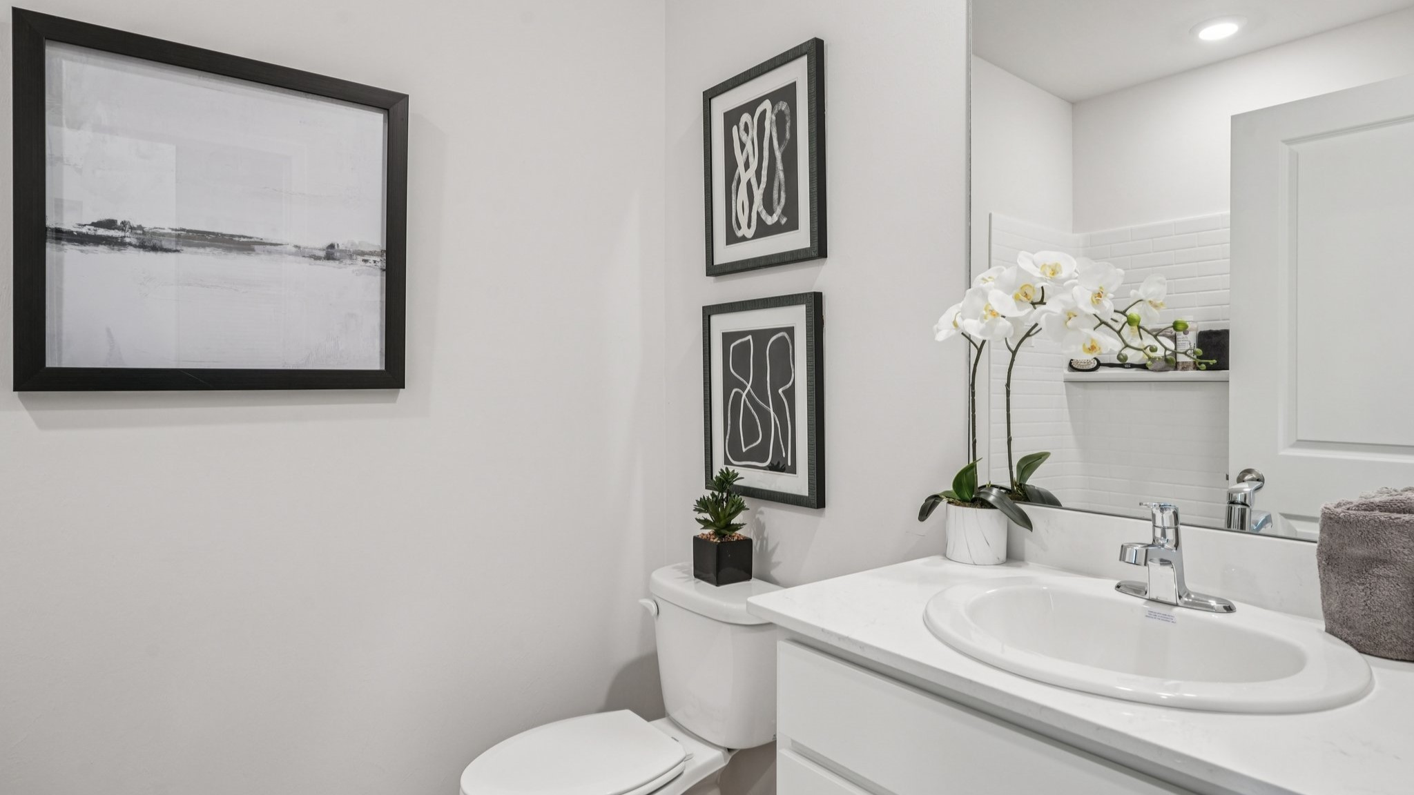 Inside the Carrington bathroom. White cabinets and countertops.