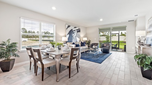 Inside of the Carrington model dining room that seats up to 6 people, you can see the living room and lanai from here.