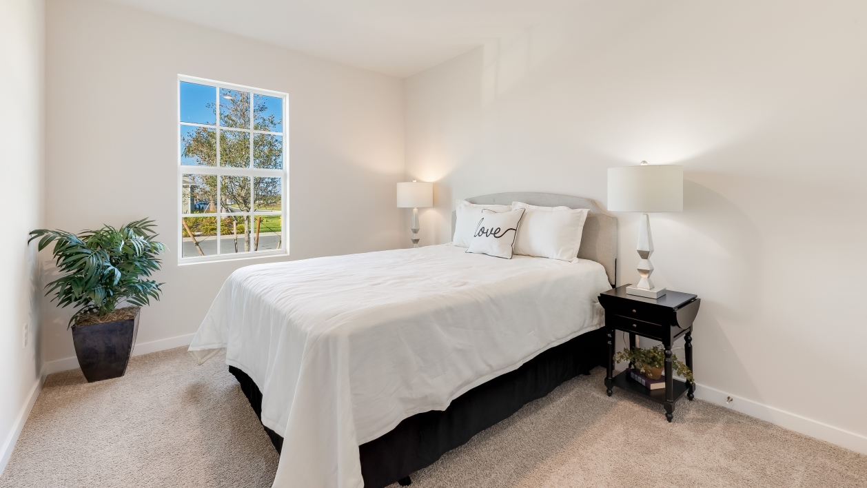 Inside of the secondary bedroom with closet space.