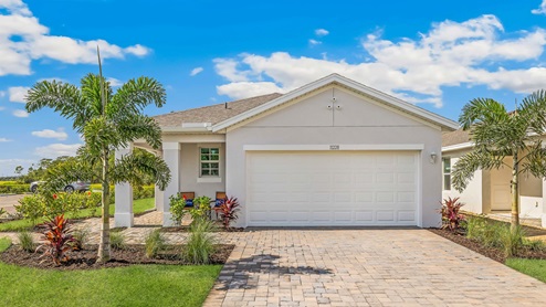 Outside of the Jemison D model. Yellow home with two car garage, one window, and front door. Mixed paver driveway. Outside of the Jemison C model. Brown home with two car garage, one window, and front door. Mixed paver driveway.