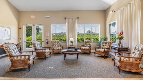 Inside the amenity center event space. Six armchairs