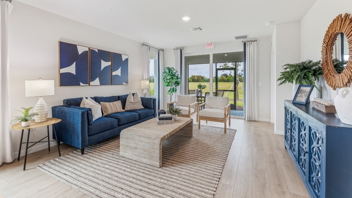Inside of the Carrington model living room. View of the lanai from here