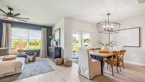 Inside of the Cali model living area. This photo demonstrates how the living area also uses an open concept and so the dining area and kitchen can be seen from the living area.
