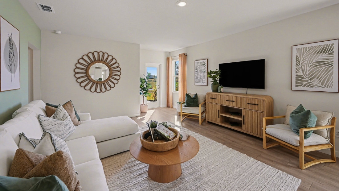 Inside of the Harper model in Central, FL. Living room with patio access to outside.