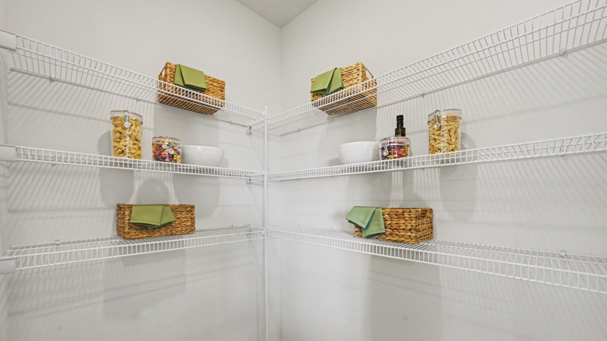 Inside of the Harper model in Central, FL. Kitchen walk-in Pantry