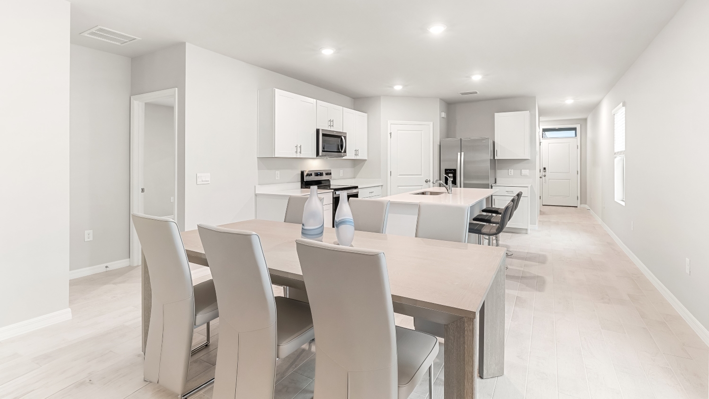Another angle of the dining area. This angle shows how the dining space connects to the kitchen.