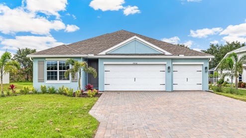 Outside of the Madison single family home with a 2.5 garage.