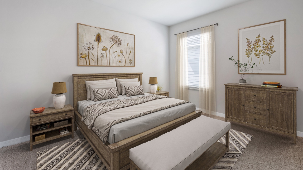 Inside the third bedroom of the Lakeside. Carpetted floors and gray walls with Farmhouse style décor. There is a window for viewing the landscaped area outside.