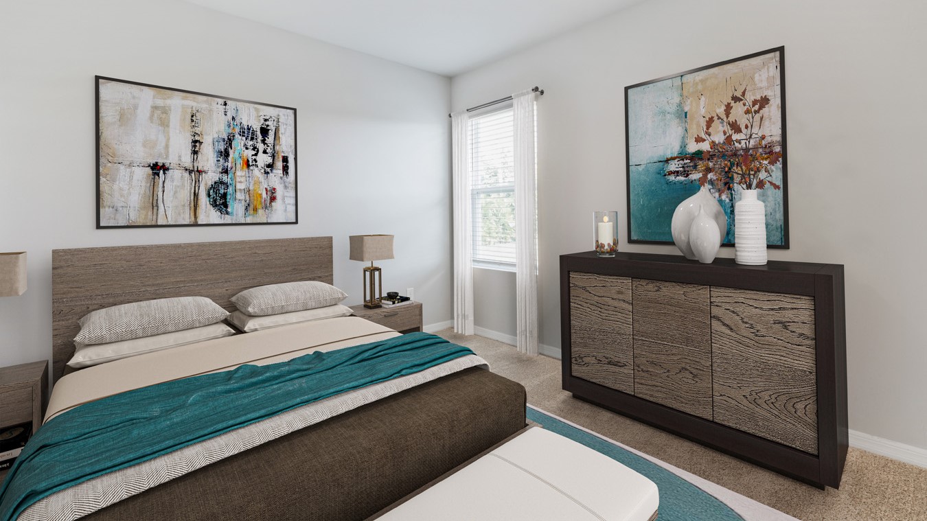 Inside of the Madison bedroom two. Creme carpet with off-white walls. Room contains bed with two nightstands on either side of bed, and dresser. Room also contains window.