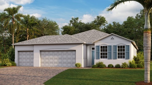 Outside of the Delray A model. White home with two car garage, two windows with shutters, and front door. Mixed paver driveway.