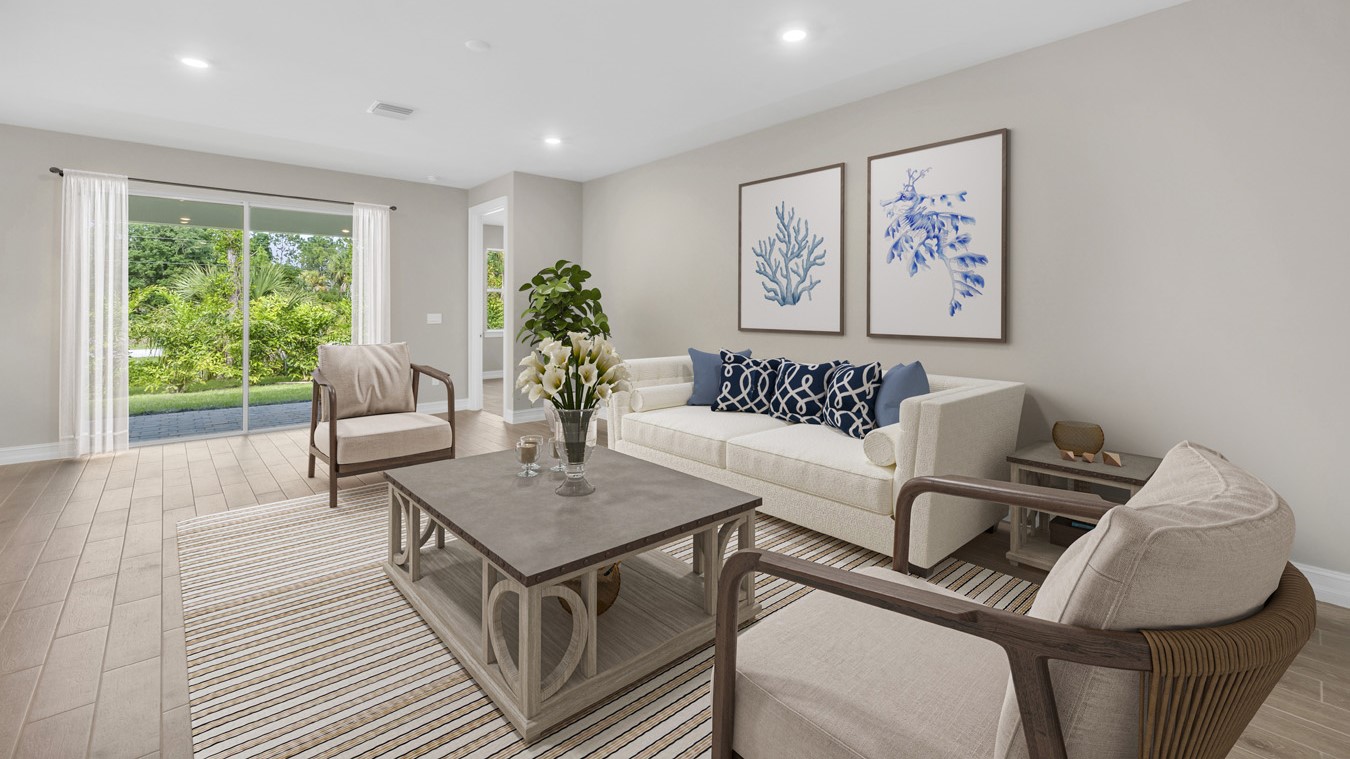 Inside Delray living room. Different angle than last photo, this photo demonstrates that the living room connects to the kitchen, bedroom four, and backyard patio.