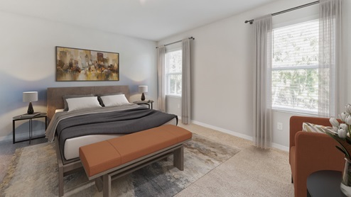 Inside of the Madison bedroom one. Creme carpet with off-white walls. Room contains bed with two nightstands on either side of bed, bench at the end of the bed, and armchair in corner. Room contains two windows.